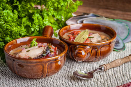Mussels with onion and parsley in tomato sauce.の写真素材