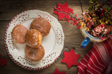Small donuts with icing on the plate. Small depth of field.の写真素材