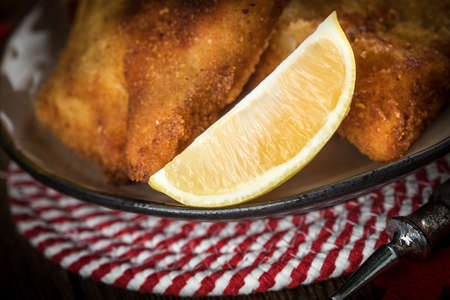Fried cod slices in breadcrumbs. Small depth of field.の写真素材