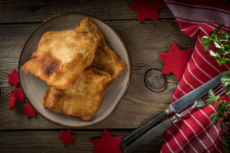 Fried cod slices in breadcrumbs. Small depth of field.