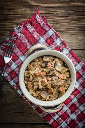 Traditional polish sauerkraut (bigos) with mushrooms and meat. Shallow depth of field.の写真素材