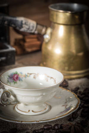 Turkish coffee in copper coffee pot on wooden background.の写真素材