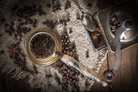 Turkish coffee in copper coffee pot on wooden background.の写真素材