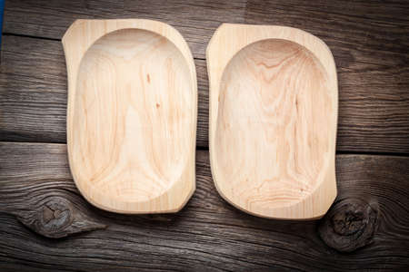 Old wooden utensils on a brown table. Selective focus.の写真素材