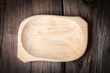 Old wooden utensils on a brown table. Selective focus.の写真素材