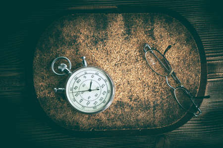 An old stopwatch on a cork background. Vintage style.の写真素材