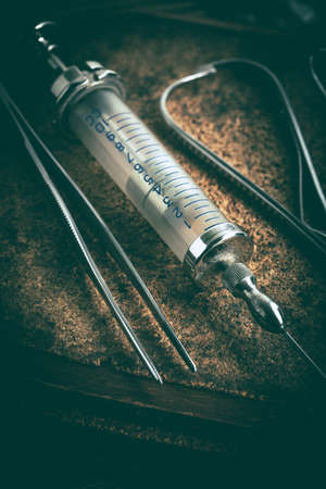 Old medicine equipment on wooden background. Vintage style.
