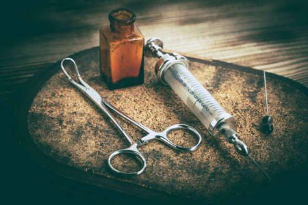 Old medicine equipment on wooden background. Vintage style.の写真素材