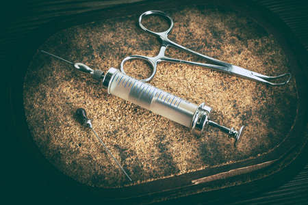 Old medicine equipment on wooden background. Vintage style.の写真素材