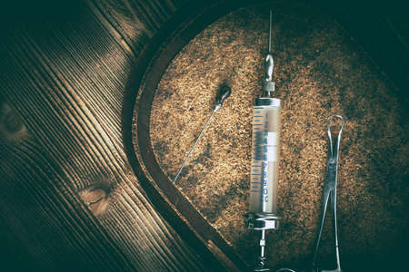 Old medicine equipment on wooden background. Vintage style.の写真素材