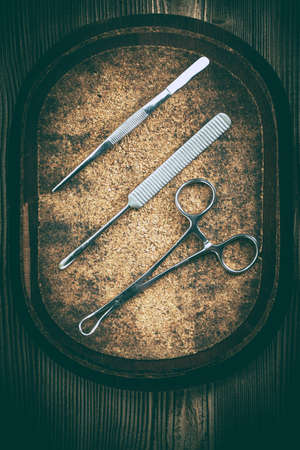 Old medicine equipment on wooden background. Vintage style.の写真素材