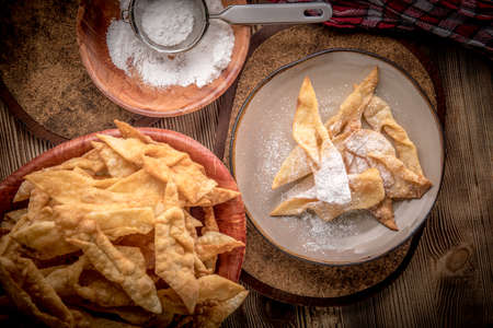 Faworki decorated with powdered sugar. Selective focus.の写真素材