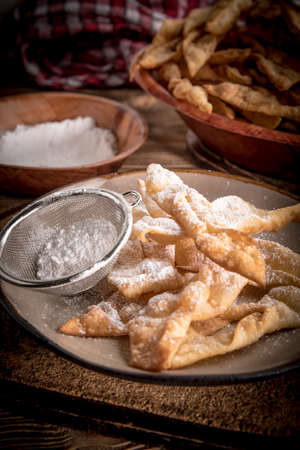 Faworki decorated with powdered sugar. Selective focus.の写真素材
