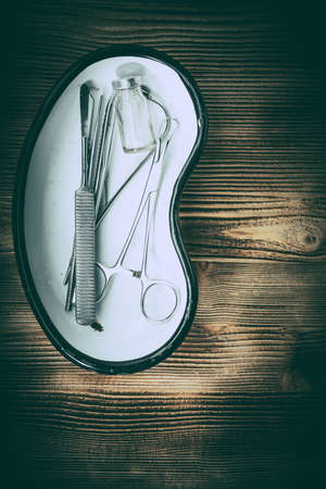 Old medicine equipment on wooden background. Vintage style.の写真素材