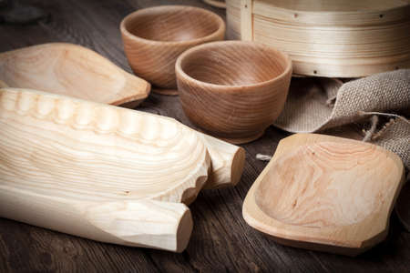 Old wooden utensils on a brown table. Selective focus.の写真素材