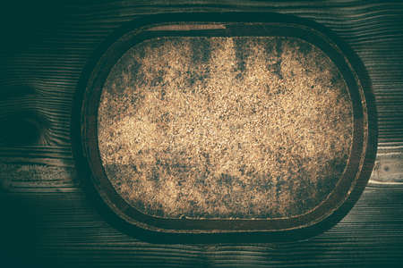 Empty pad with cork on a wooden background. Vintage style.