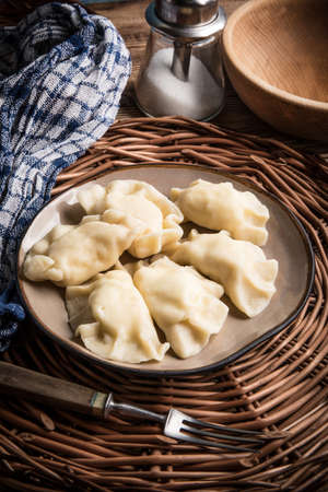 Homemade dumplings with cheese on a plate.の写真素材