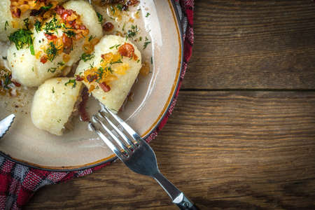 Potato dumplings stuffed with minced meat on wooden table.  Top view.の写真素材