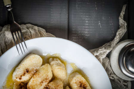 Lazy dumplings with cinnamon and sugar. Dark light.の写真素材
