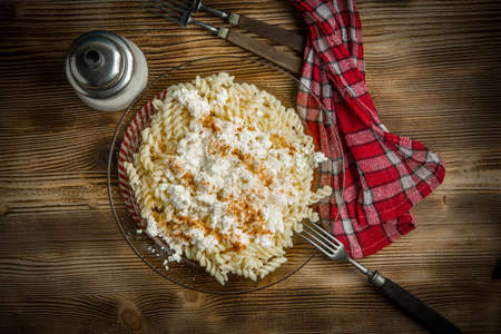 Healthy homemade food. Fusilli pasta with cottage cheese, sugar and cinnamon. の写真素材