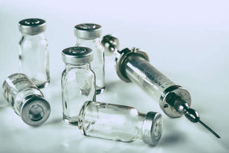 Retro medical tools on a wooden table. Selective focus. Filtered style.