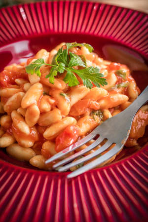 Cavatelli pasta with fresh tomato sauce. Italian cuisine.の写真素材