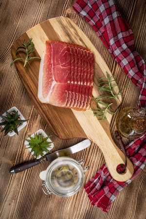 Thinly sliced German black forest on wooden table.の写真素材