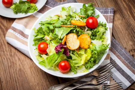 Mixed salad in white bowl. Selective focus.の写真素材