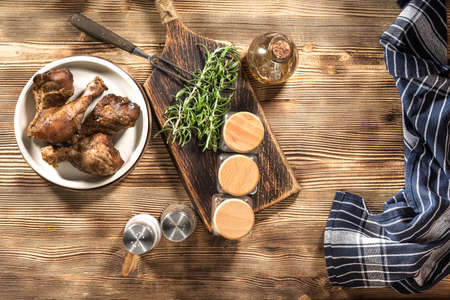 Raw marinated chicken drumsticks rubbed with finely ground spice  prepared to roast.の写真素材