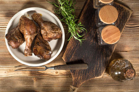 Raw marinated chicken drumsticks rubbed with finely ground spice  prepared to roast.の写真素材