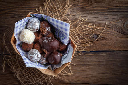 Homemade sweet balls on a wooden table. Selective focus.