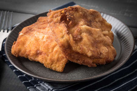 Two fried cod fillet pieces. Small depth of field.の写真素材