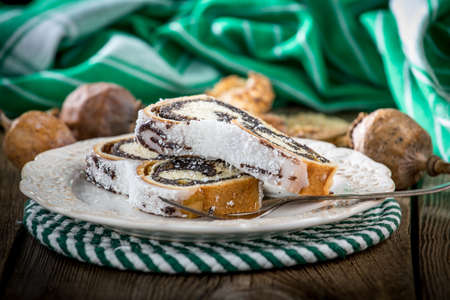 Two pieces of poppie-seed cake on a plate. Selective focus.の写真素材