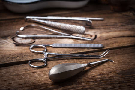 Retro medicalinstruments on a wooden table. Shallow depth of field.の写真素材