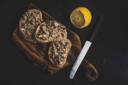 Slices of multigrain bread with sprats.の写真素材