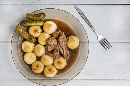 Stewed turkey meat served with silesian dumplings and sauce. Top viewの写真素材