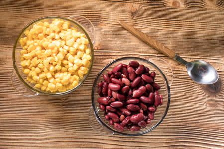 Sweet corn and boiled red beans in glass bowls.の写真素材
