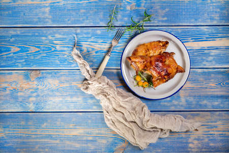 Chicken quarters baked on plate. Top view.の写真素材