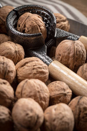 Whole nuts in a metal container. Shallow depth of field.の写真素材