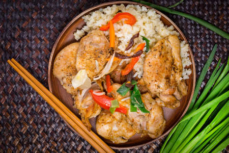 Fried pieces of chicken served with rice and vegetables.  Top view.の写真素材