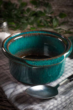 Empty dish for baking on wooden countertop. の写真素材
