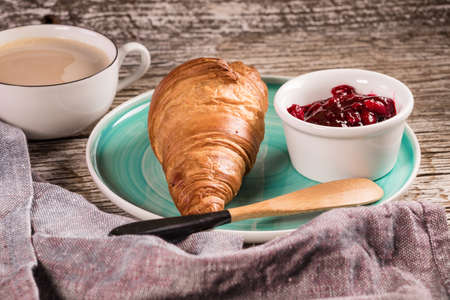 Fresh croissants with jam for breakfast.の写真素材