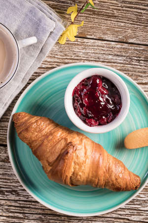 Fresh croissants with jam for breakfast. Top view.の写真素材