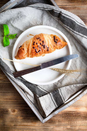 Fresh croissant on a white plate.の写真素材