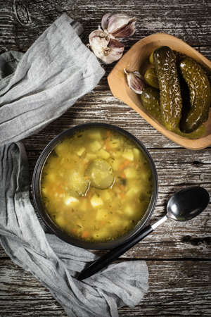 Vegetarian cucumber soup in dark bowl. Top view.の写真素材
