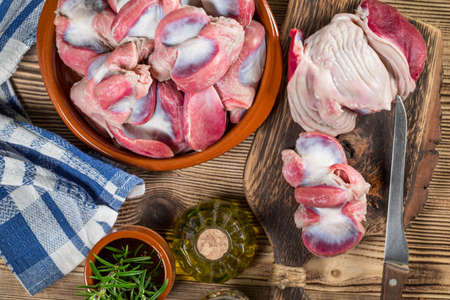 Raw uncooked turkey gizzards. Shallow depth of field.