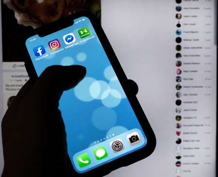 KATOWICE, POLAND - FEBRUARY 24, 2020: IPhone XS screen with application icons. Polish version.のeditorial素材