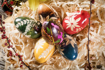 Decorated eggs on a wooden board. Shallow depth of field.の写真素材
