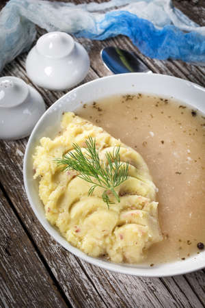Pure white borscht served with mashed potatoes.の写真素材