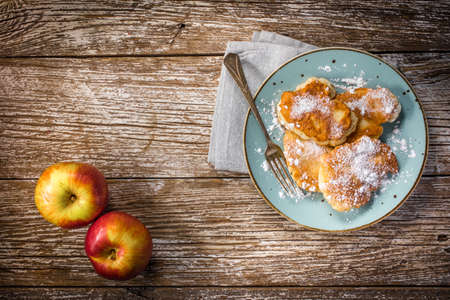 Sweet pancakes made of apple, milk and flour. Top view.の写真素材